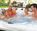 Family spending time in a hot tub